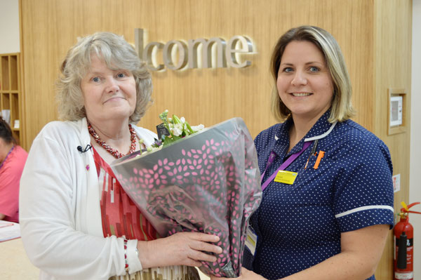 Janet James, the first patient in the new Seamoor Unit, receives a bouquet of flowers from lead nurse Charlotte Overney.